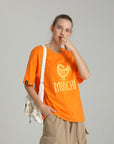 MONCHI™ T-SHIRT ORANGE INITIAL