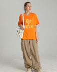 MONCHI™ T-SHIRT ORANGE INITIAL