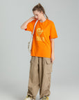 MONCHI™ T-SHIRT ORANGE INITIAL